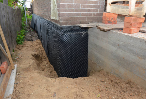 Happy homeowners after waterproofing job in New Bloomington